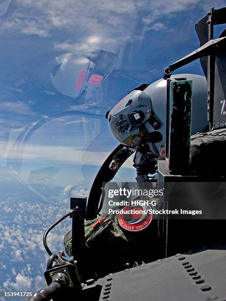 an f-15 eagle pilot flies in formation with his wingman. - us air force pilot stock pictures, royalty-free photos & images