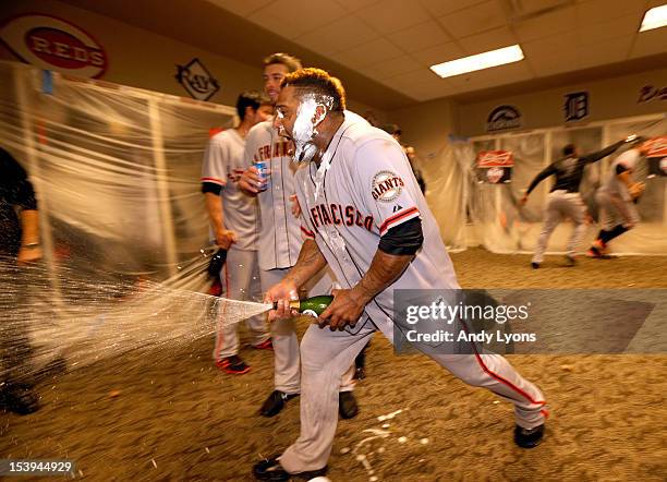 Pablo Sandoval of the San Francisco Giants celebrates in the locker room following Game Five of the National League Division Series against the...