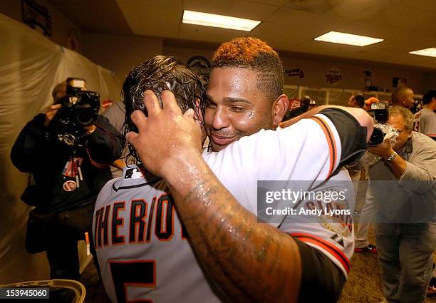 Ryan Theriot and Pablo Sandoval of the San Francisco Giants celebrate in the locker room following Game Five of the National League Division Series...
