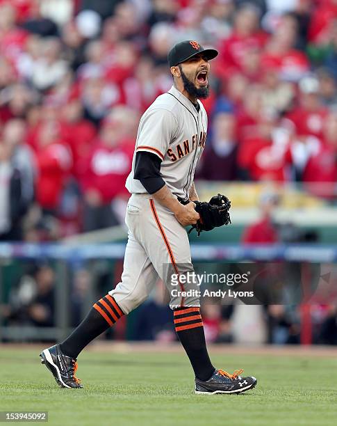 Sergio Romo of the San Francisco Giants celebrates following the last out og Game Five of the National League Division Series against the Cincinnati...
