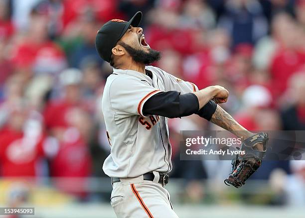 Sergio Romo of the San Francisco Giants celebrates following the last out og Game Five of the National League Division Series against the Cincinnati...