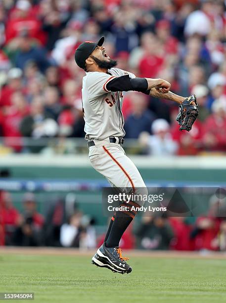 Sergio Romo of the San Francisco Giants celebrates following the last out og Game Five of the National League Division Series against the Cincinnati...