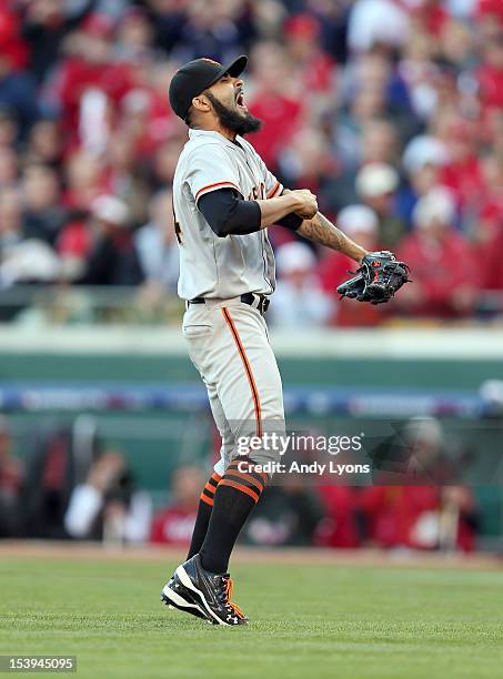 Sergio Romo of the San Francisco Giants celebrates following the last out og Game Five of the National League Division Series against the Cincinnati...