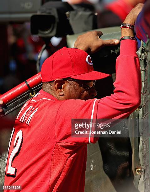 Manager Dusty Baker of the Cincinnati Reds watches as his team takes on the San Francisco Giants in Game Five of the National League Division Series...