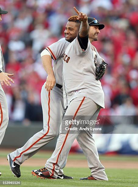 Pablo Sandoval of the San Francisco Giants celebrates with Xavier Nady following the last out og Game Five of the National League Division Series...