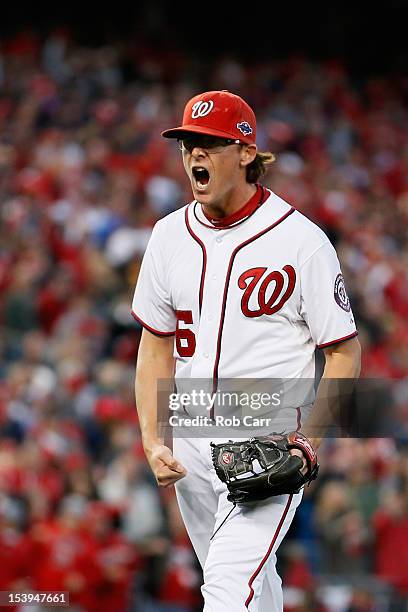 Tyler Clippard of the Washington Nationals reacts after he struck out the side to end the top of the eighth inning against the St. Louis Cardinals...