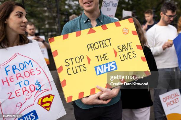 Workers picket outside St Thomas' Hospital on July 13, 2023 in London, England. Junior doctor members of the BMA are striking for a 35% pay increase,...