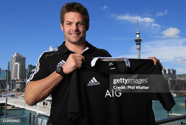 All Black captain Richie McCaw holds up the new All Black jersey during a NZRU and AIG sponsorship announcement at Viaduct Events Centre on October...