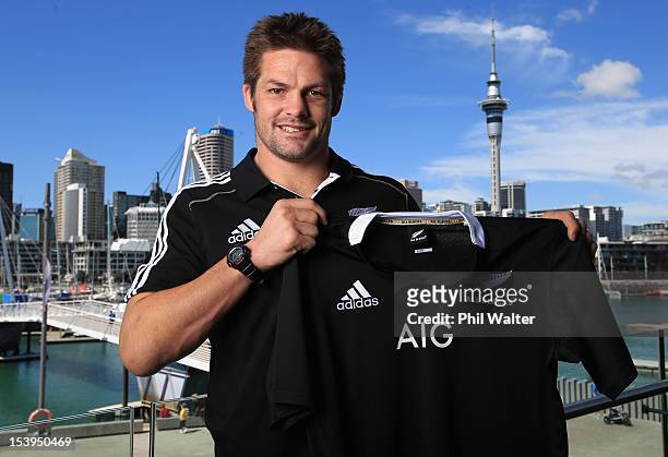 All Black captain Richie McCaw holds up the new All Black jersey during a NZRU and AIG sponsorship announcement at Viaduct Events Centre on October...