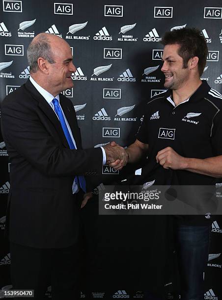 All Black captain Richie McCaw and AIG Executive Vice President Peter Hancock pose with the All Black jersey during a NZRU and AIG sponsorship...