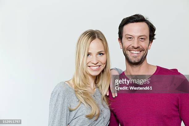 couple smiling against white background, portrait - two people white background stock pictures, royalty-free photos & images