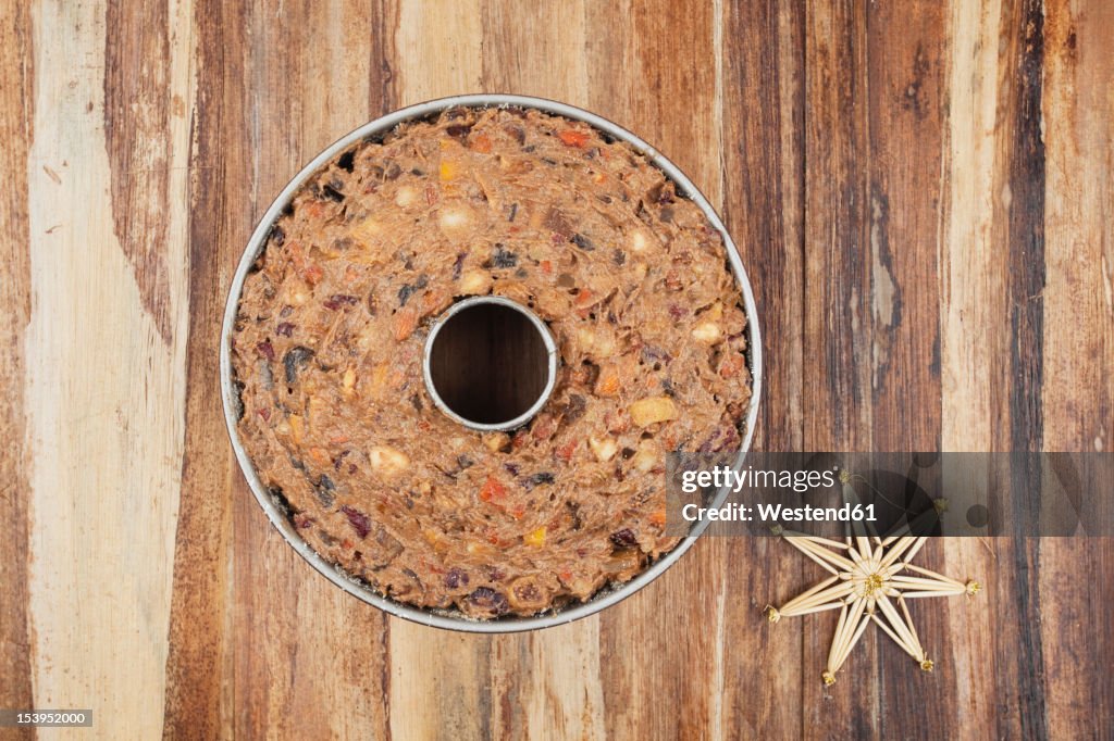 Cake pan filled with Christmas fruit cake ingredient