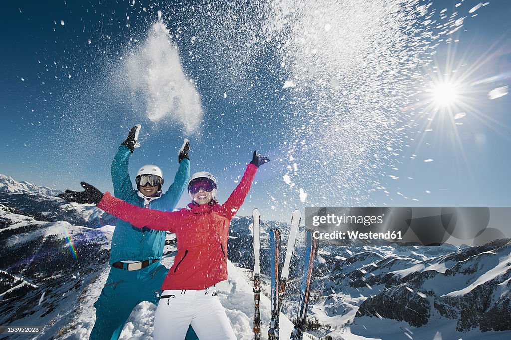 Austria, Salzburg, Young couple standing on top of mountain