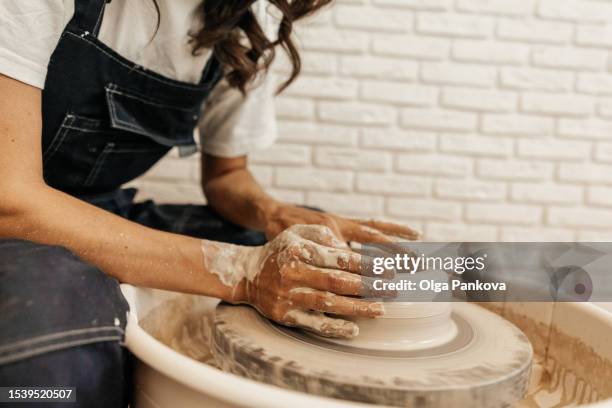 female potter in his workshop - potter's wheel stock pictures, royalty-free photos & images
