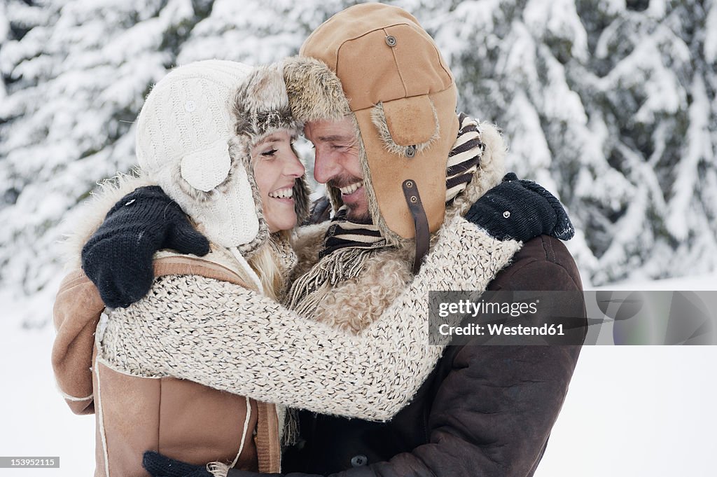 Austria, Salzburg County, Couple embracing each other, smiling