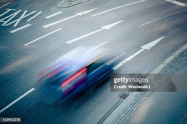 germany, bavaria, munich, traffic on road - car speeding stock-fotos und bilder