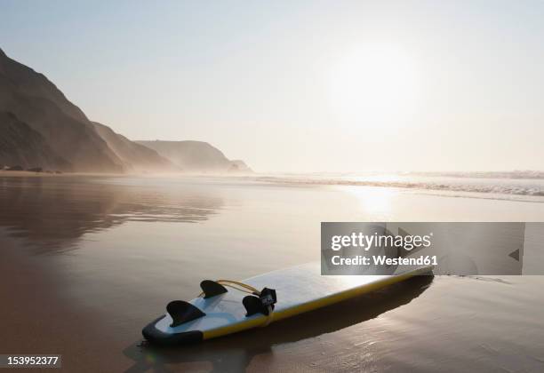 portugal, surfboard on beach - surfbrett stock-fotos und bilder