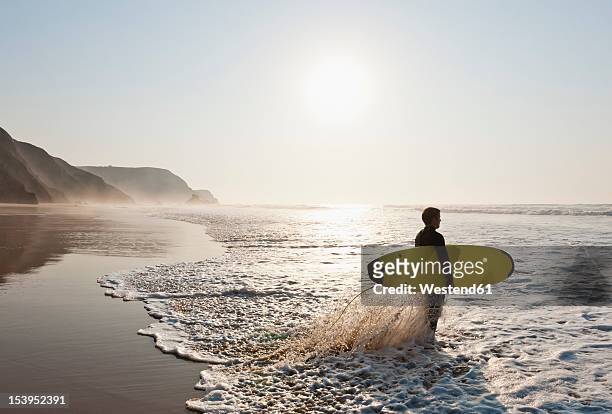 portugal, surfer on beach - sagres ストックフォトと画像