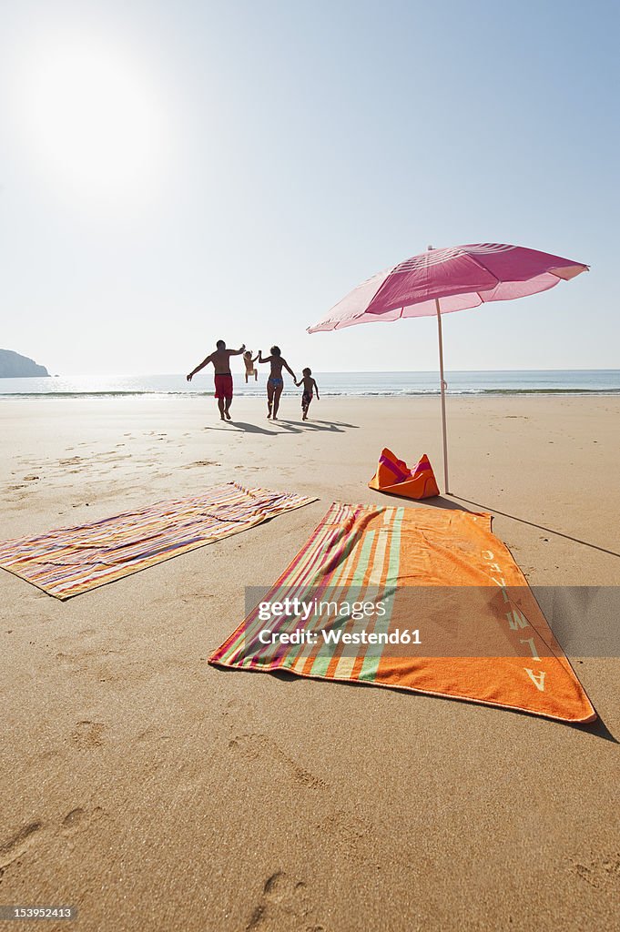 Portugal, Family running on beach