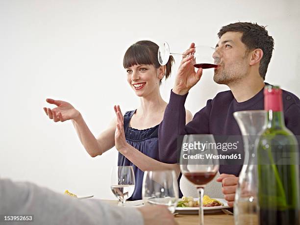 germany, cologne, men and woman having dinner - gast stock-fotos und bilder