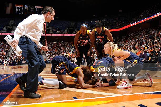 Katie Douglas of the Indiana Fever goes down with an injury during Game Three of the Eastern Conference Finals against the Connecticut Sun on October...