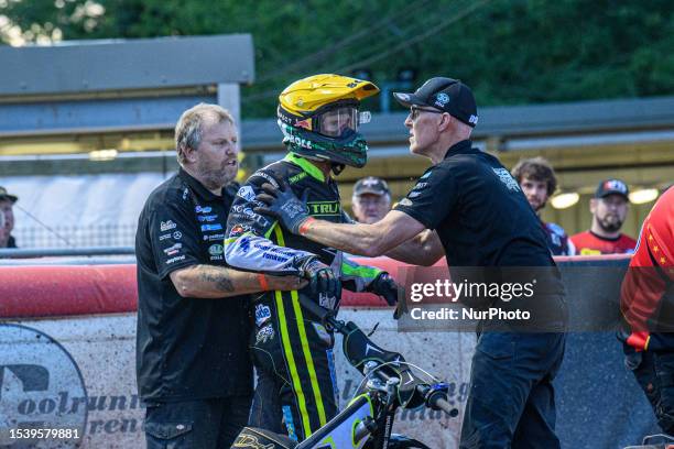 Jason Doyle is held back by his mechanics following an on track incident which upset him during the Sports Insure Premiership match between Belle Vue...