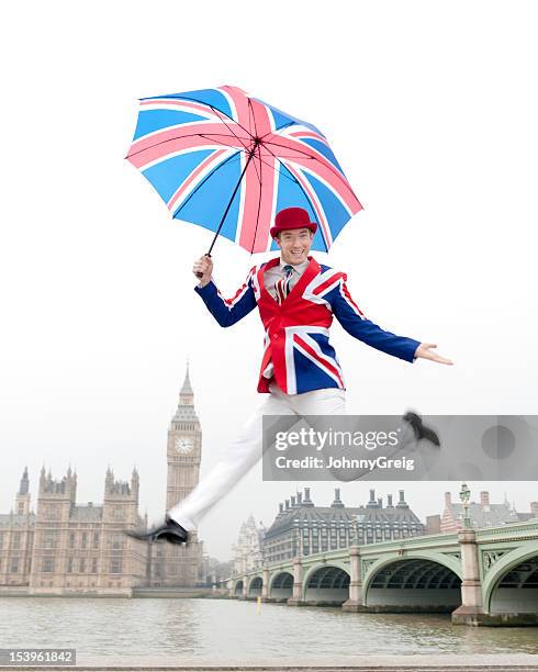 jumping british man in london with big ben - stereotypical stock pictures, royalty-free photos & images