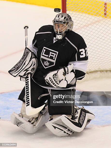 Goaltender Jonathan Quick of the Los Angeles Kings looks for the puck in the third period in Game Four of the Western Conference Quarterfinals...
