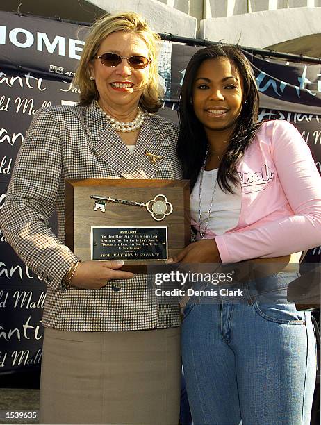 Glen Cove Mayor Mary Ann Holzkamp gives Murder Inc./Def Jam recording artist Ashanti the key to Glen Cove May 3, 2002 at Roosevelt Field Mall in...