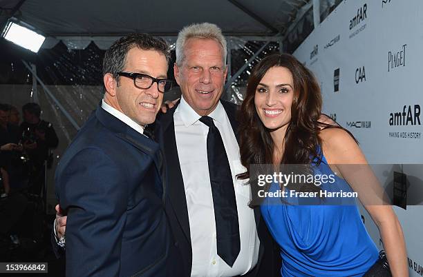 Designer/amFAR Chairman Kenneth Cole, New York Giants Chairman/Executive VP Steve Tisch and Nicole Butler arrive at amfAR's Inspiration Gala at Milk...