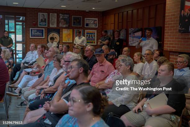Crowd in an overflow room listen as Sen. Joe Manchin III and former Utah governor Jon Huntsman speak at the 'Common Sense' Town Hall, an event...