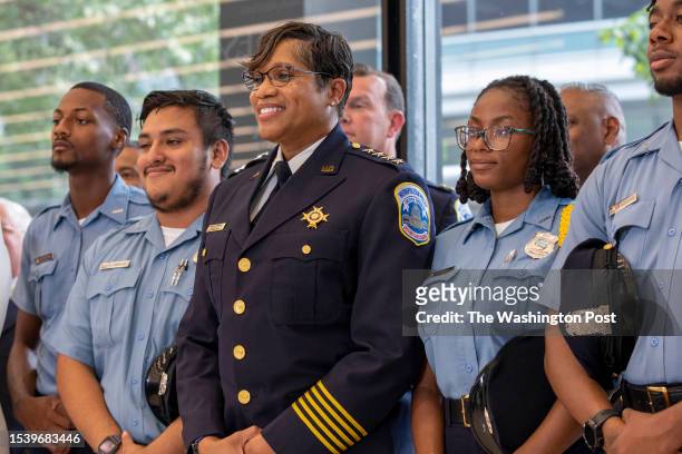 Newly-appointed police chief Pamela A. Smith poses for a photo with members of the Cadet Corps the Martin Luther King Jr. Memorial Library in...