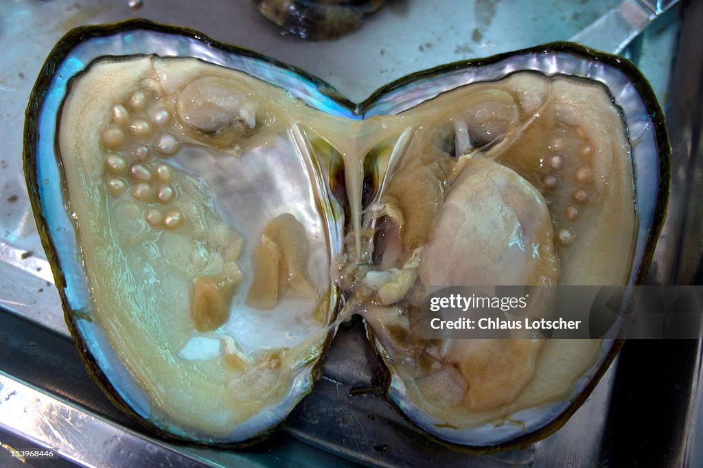 Open oyster showing perals inside,