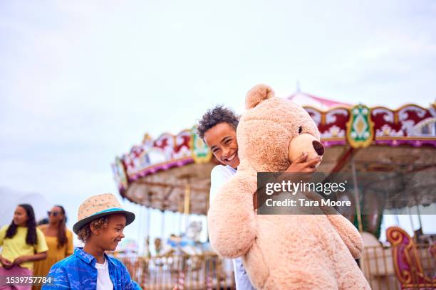 family at the funfair - festival pier stock pictures, royalty-free photos & images