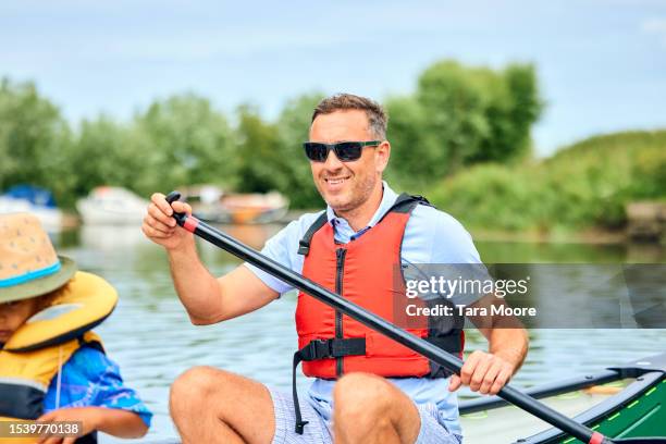 family canoe adventure - life jacket photos stock pictures, royalty-free photos & images