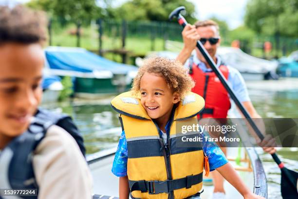 family canoe adventure - life jacket photos stock pictures, royalty-free photos & images