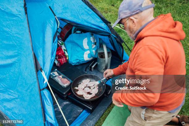 camper cooking breakfast - tent stock pictures, royalty-free photos & images