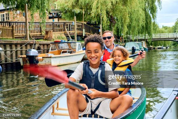 family canoe adventure - life jacket photos stock pictures, royalty-free photos & images