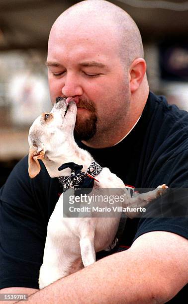 Pertie, the Chihuahua, kisses her owner Brian Hollingsworth before competing in the Fifth Annual Chihuahua Race May 4, 2002 in Shreveport, LA. Pertie...