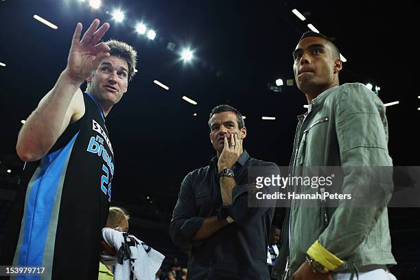 Dillon Boucher of the Breakers meets with All Whites Winston Reid and Ryan Nelsen following the round two NBL match between the New Zealand Breakers...