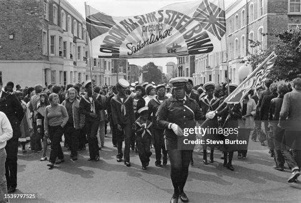 Members of the London All Stars Steel Band participating in the parade at Notting Hill Carnival in London, August 27th 1979.