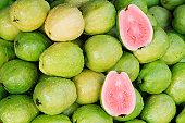 A photo of fresh red guavas, a typical tropical fruit