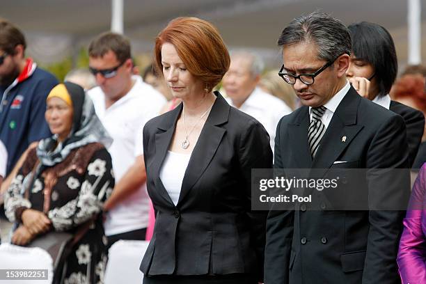 Australian Prime Minister Julia Gillard and Indonesian Foreign Minister Marty Natalegawa pray during the Bali Bombing 10th anniversary memorial...