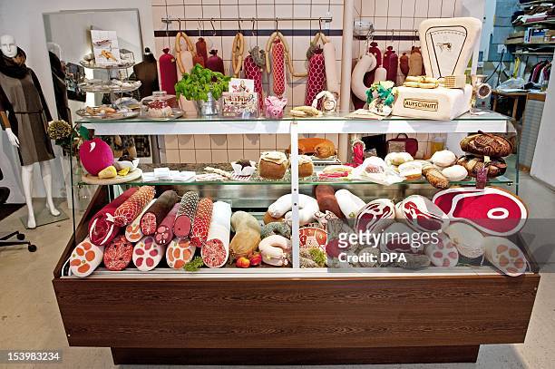 Meat and saussages made of cloth are visible at the mock butchery and fashion studio 'Aufschnitt' of artist Silvia Wald in Berlin, on October 10,...
