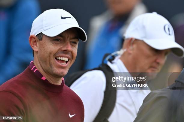 Northern Ireland's Rory McIlroy laughs as he walks from the 15th tee during a practice round for 151st British Open Golf Championship at Royal...