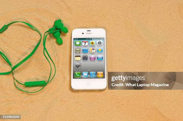 An Apple iPhone 4, shot in a beach scenario during a holiday technology feature, February 6, 2012.