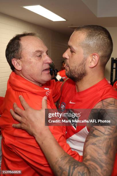 Swans head coach John Longmire celebrates with Lance Franklin of the Swans after victory during the round 18 AFL match between Sydney Swans and...