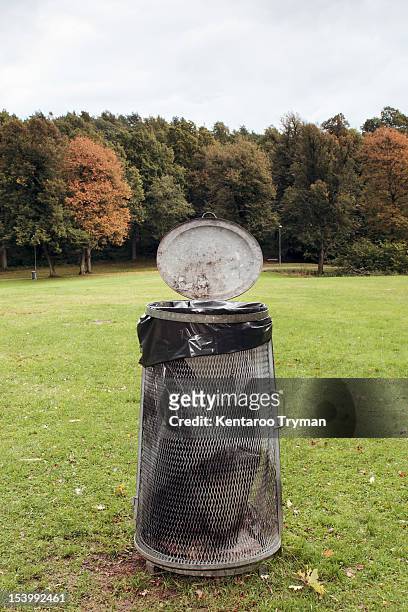 garbage can in park - garbage can stock pictures, royalty-free photos & images