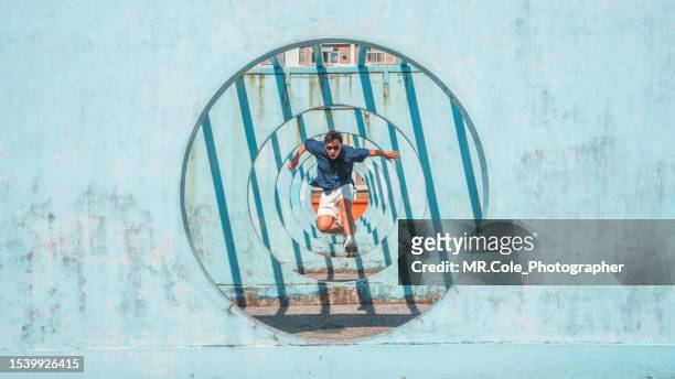 asian man jumping out of circle - leap forward stock pictures, royalty-free photos & images