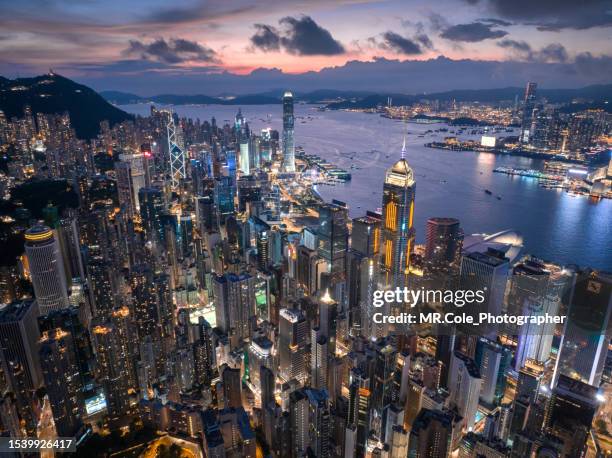 aerial view of hong kong city skyline with beautiful sunset - hong kong island stock pictures, royalty-free photos & images